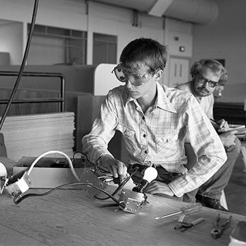 A student works on an electronics project.